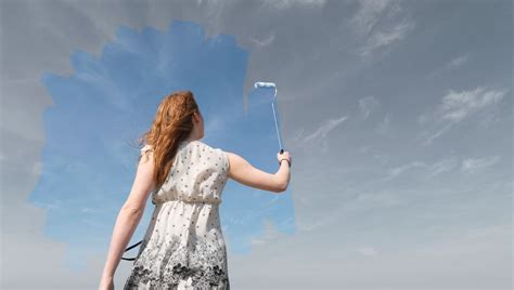 escape from everyday's life : woman cleaning a window to see the sky